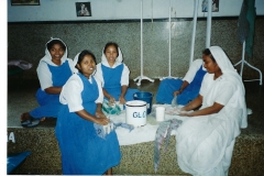 12 Nuns sorting gloves Dec. 1996 (c) AliciaYoung.net